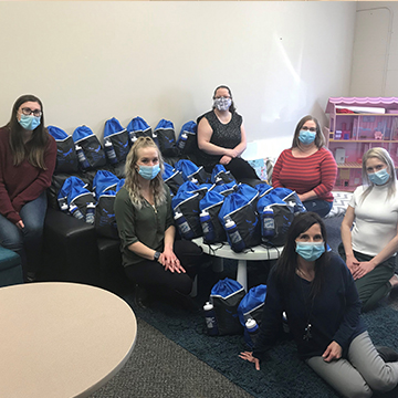 Students with the hospital care kits for Dragonfly Centre