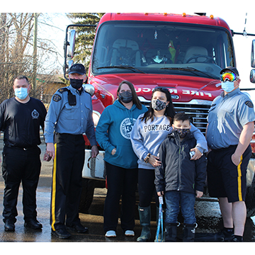 Group from Polar Plunge in front of fire truck