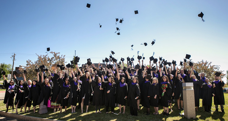 Graduates toss their hats at Convocation in 2016