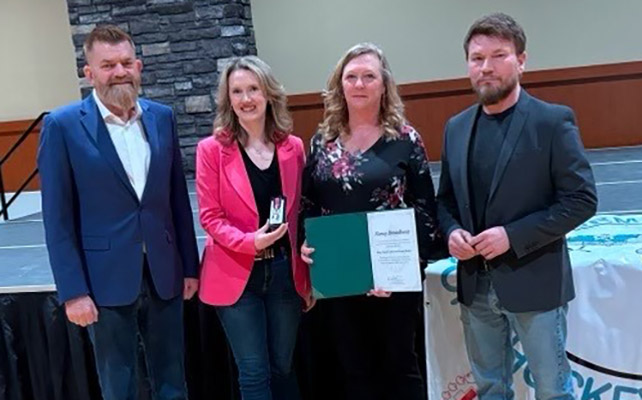 MLA and Alberta Energy Minister Brian Jean, MP Laila Goodridge, Portage College President Nancy Broadbent and Lac La Biche County Mayor Paul Reutov at the recent ceremony to present the King Charles III Coronation Medal.