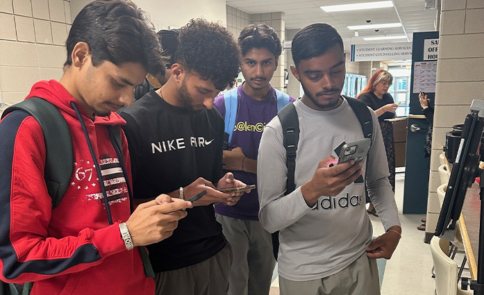 image of students downloading app