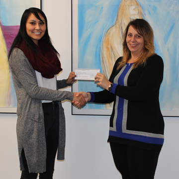 Megan Shott presenting SAPC cheque to Museum Director Donna Feledichuk